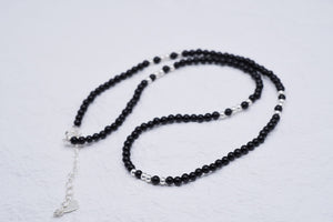 Elegant black onyx and silver beaded necklace with heart charm. Minimalist style. Buddhist prayer beads for meditation.