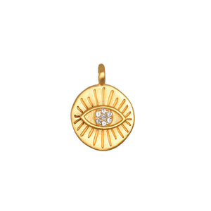 Gold pendant with eye design and clear stones on a white background