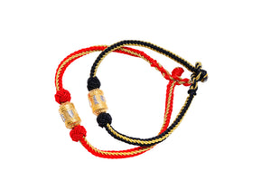 Two Tibetan mantra bracelets, one red, one black, with gold-embossed beads on a white background.