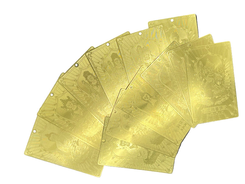 Gold Tibetan Buddhist talisman cards fanned out, etched with deities and Chinese characters. Perfect for protection and mindful energy.