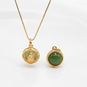 Two green and gold pendants, one on a necklace, showcase spiritual jewelry with beaded detail and religious icon.