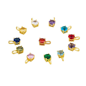 Gemstone birthstone charms in gold vermeil. Colorful pendants: ruby, sapphire, emerald, amethyst, diamond. Elegant sterling silver jewelry.