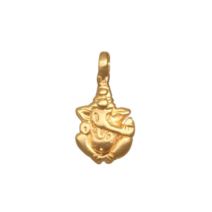 Golden Ganesha pendant charm, a symbol of success and remover of obstacles. Detailed Hindu deity jewelry on a red string bracelet.