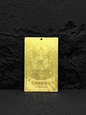 Gold rectangular Buddha pendant with Chinese characters on textured black background. Tibetan Buddhist amulet necklace.