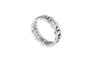 Sterling silver Tibetan ring on white background. Minimalist wavy band engraved with "LET IT BE." Promotes meditation and inner balance.
